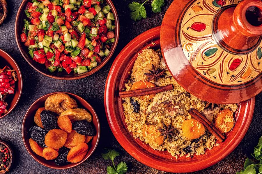 Dig into Morocco’s diverse cuisine, a fusion of cultural influences — Amazigh, Arab, Jewish, and French — including its beloved staple, couscous